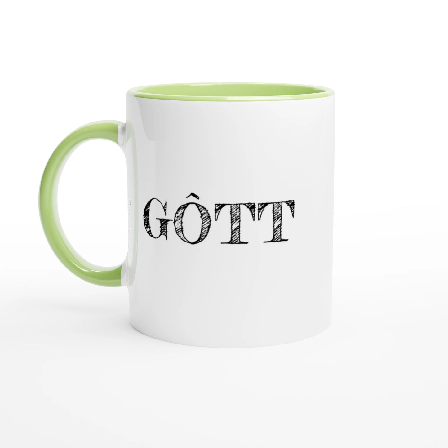 Vit fika-mugg med grön insida och handtag. Texten GÔTT tryckt i svart vintage-stil på utsidan.