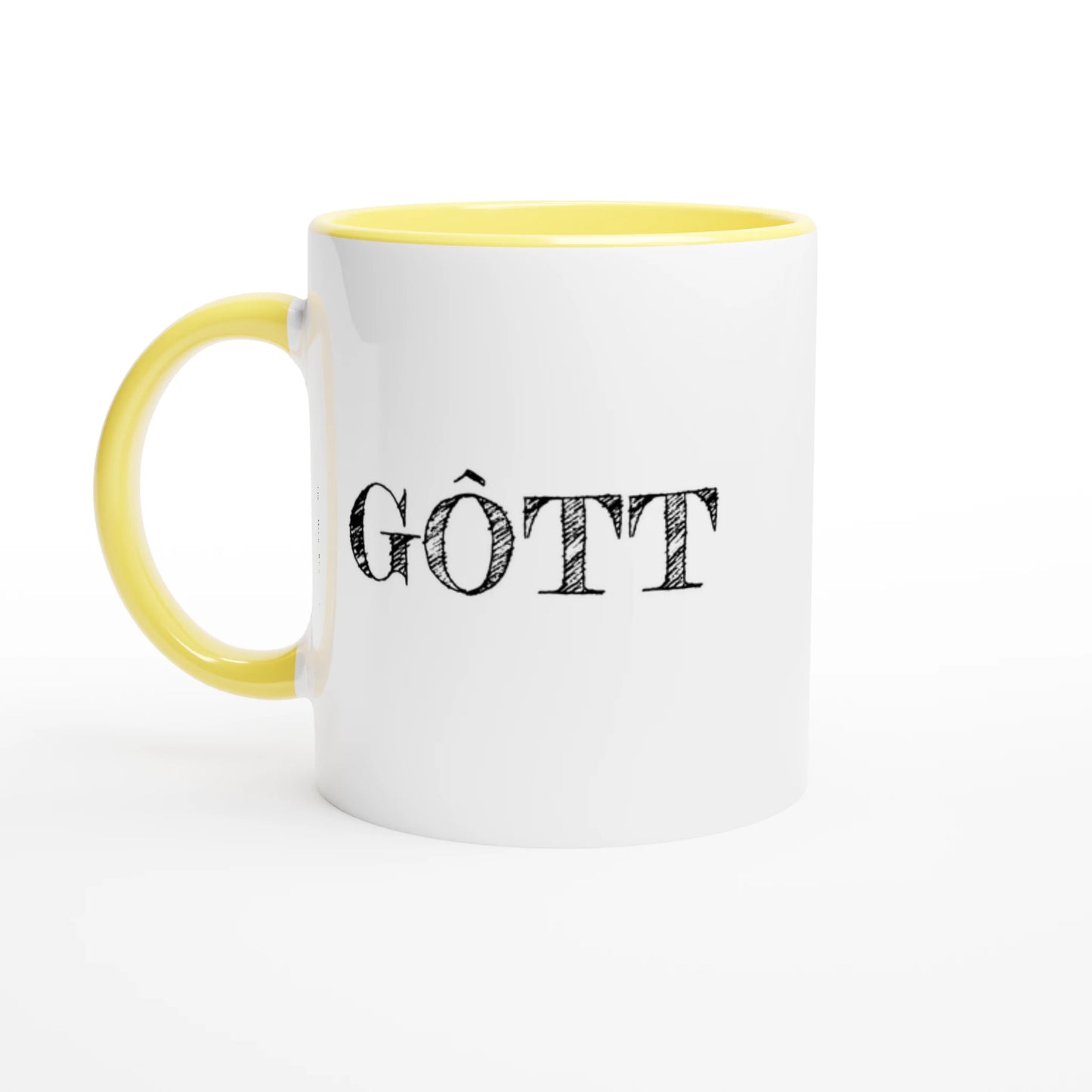 Vit fika-mugg med gul insida och handtag. Texten GÔTT tryckt i svart vintage-stil på utsidan.