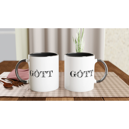 Två vita kaffemuggar med svart insida och texten GÔTT, visade på ett bord för att demonstrera trycket på båda sidor. Perfekt present till göteborgaren.
