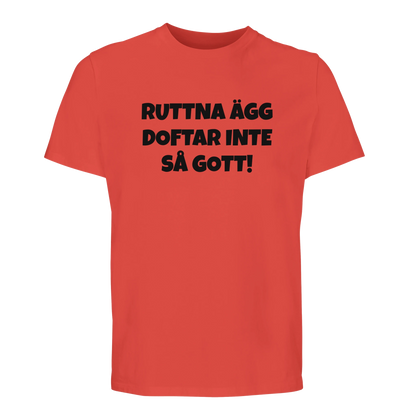 Orange t-shirt med humortryck 'Ruttna ägg doftar inte så gott'. Tillverkad i mjuk bomull för hög komfort.